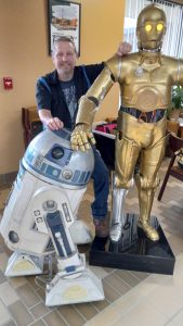 Ryan Huffman of the R2 Builders group, with two of his builds.